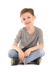 Canvas Print - Little boy in stylish t-shirt on white background