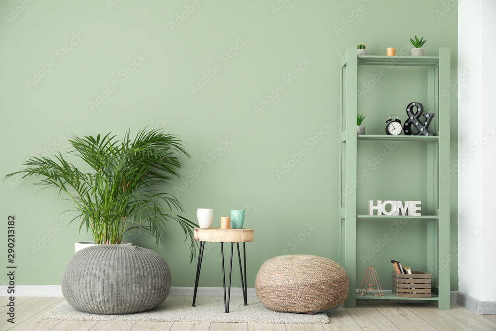 Stylish interior of room near color wall