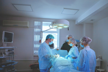 Wall Mural - Team of surgeons doing surgery