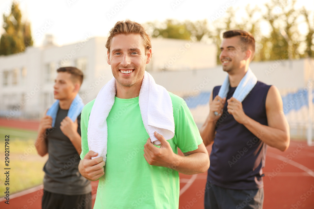 Group of sporty young people at the stadium
