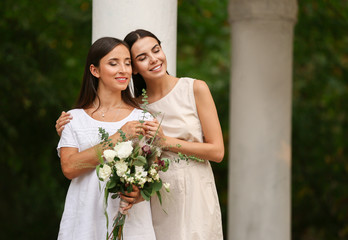 Poster - Beautiful lesbian couple on their wedding day outdoors