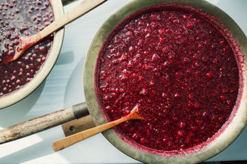 Wall Mural - two basins of homemade preparations with strawberry and raspberry jam