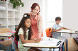 © zinkevych - Beaming teacher feeling good while doing her favorite job