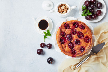 Wall Mural - plum torte on a white platter, flat lay