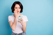 © deagreez - Portrait of her she nice attractive worried nervous girl using app 5g internet online media followers subscribe dislike isolated on bright vivid shine vibrant blue turquoise color background