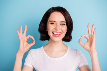 Wall Mural - Close-up portrait of her she nice attractive cheerful cheery glad positive girl showing two ok-sign ad advert good solution isolated on bright vivid shine vibrant blue turquoise color background