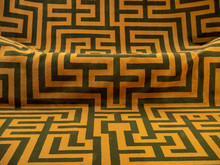 Black Angular Lines On An Orange Fabric Background, Ancient Greek Labyrinth Pattern