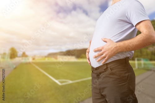 Fotomural Man with fat stomach. Lose weight concept.