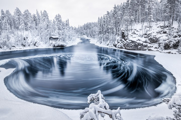 Wall Mural - The whirlpool in Myllykoski scenic area at winter in Oulanka National Park, Kuusamo, Finland