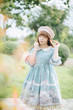© Oran Tantapakul - Portrait of asian girl in lolita fashion dress in garden background