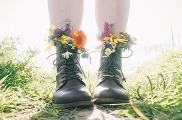 Wall Mural - flowers in boots on sunny days