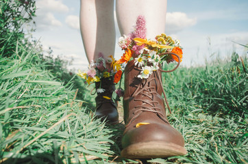 Wall Mural - flowers in boots on sunny days