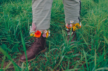 Wall Mural - flowers in boots on sunny days