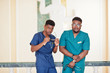 © AS Photo Family - Two professional african male doctor at the hospital. Medical healthcare business and doctor service of Africa.