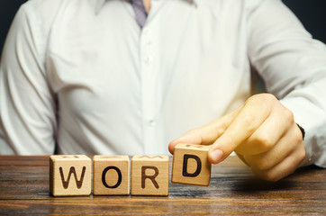 Poster - Man puts a wooden blocks with the inscription Word. The structural unit of language. Morphology. Word formation. Study of grammar. Linguistics