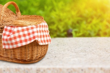 Poster - Picnic Basket with napkin om nature background