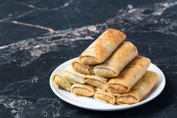 Canvas Print - Savory crepes with rice and turkey meat.