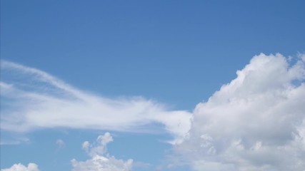 Wall Mural - time lapse of white cloud on blue sky. 4k fluffy white clouds moving during the day time