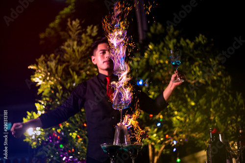 Fotografía Professional bartender is making flaming lamborghini cocktail at night party