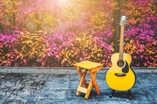 Wood Chair And Acoustic Guitar In Terrace