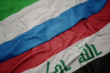 waving colorful flag of iraq and national flag of sierra leone.