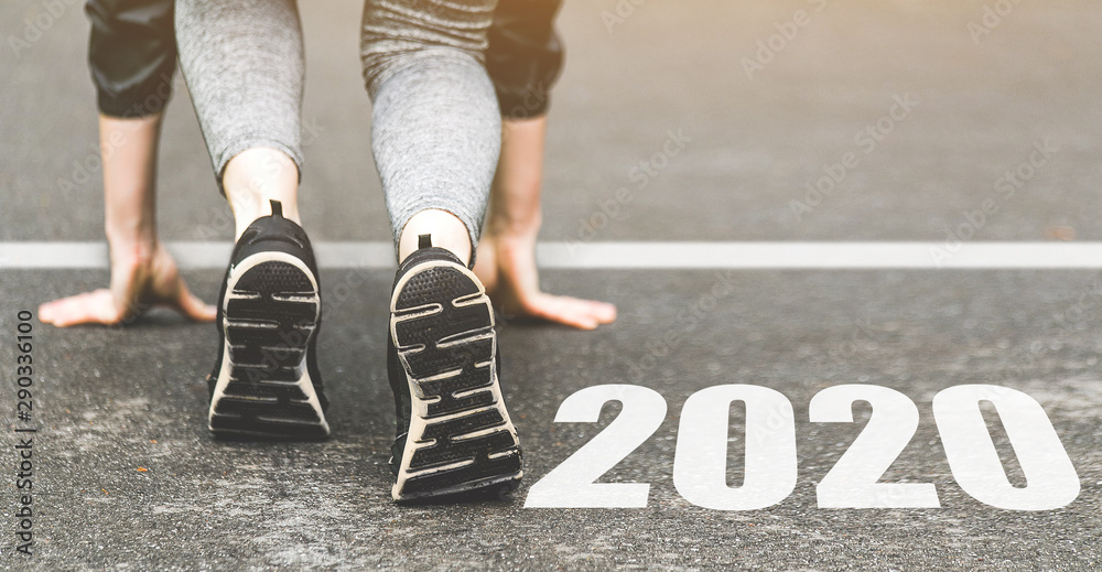 Woman in sports uniform running around. Healthy way of life, an infused figure. sneakers close-up, finish 2019. Start to new year 2020 plans, goals, objectives - obrazy, fototapety, plakaty 