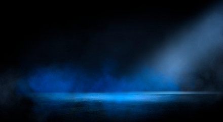 Wall Mural - blue dark background of empty foggy street with wet asphalt, illuminated by a searchlight, laser bea
