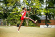 © Ursula Page - Young Handsome African American Black Male outside running in the field of a small town in georgia city ampitheater. track and field star