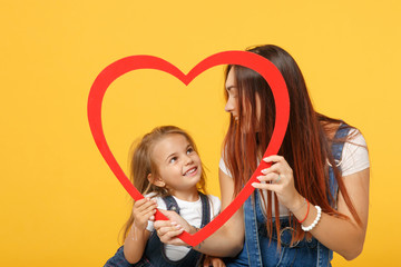 Wall Mural - Woman in light clothes have fun with cute child baby girl 4-5 years old. Mommy little kid daughter isolated on yellow background studio portrait. Mother's Day love family parenthood childhood concept.