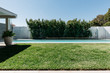 © Jodie Johnson/Stocksy - Lineal composition of lap pool and grass in a luxury home