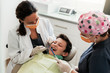 © Santi Nunez/Stocksy - Dentists during a dental intervention with a patient.