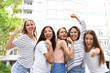 © New Africa - Happy women outdoors on sunny day. Girl power concept