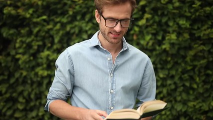 Poster - reading books mean a big win! Young happy casual man recommending reading 