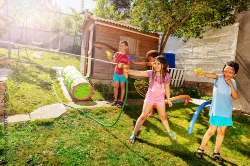 Girl With Group Of Kids Play Water Gun Fight Buy This Stock