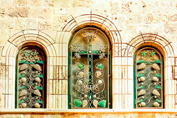 Windows of the Church of the Holy Sepulcher. cross in the window. Jerusalem, Israel