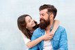 © be free - I loved her first. Bearded man and small girl child sharing love and laugh. Little daughter hugging father with love and care on grey background. Family love