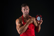 © be free - Time for master class. Master cook point at clock face on black background. Master chef wear cook apron on muscular torso. It takes time to master your skills