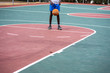 © rushay - Young boy practicing his free throws on court