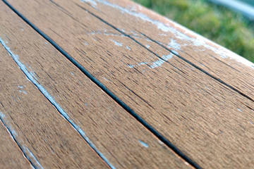 Wall Mural - Close-up of old weathered wooden board with cracks and knots.