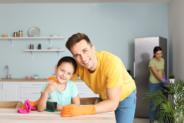 Sticker - Father and his little daughter cleaning kitchen together