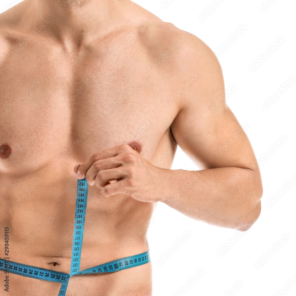 Handsome muscular man with measuring tape on white background. Weight loss concept