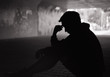 © kieferpix - Sad , lonely man sitting on city street.