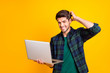 © deagreez - Photo of stressed guy with notebook in hands read bad investors reaction on startup plan wear casual checkered shirt isolated yellow color background