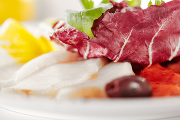 Canvas Print - Gourmet, restaurant, delicious dinner food - close up of Fish Dish with Lemon and Fresh Basil Leaves