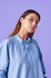 © kegfire - Trendy woman in glasses looking at camera