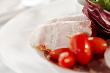 Canvas Print - Gourmet, restaurant, delicious dinner food - close up of Sliced Meats with Rocket Salad and Tomatoes