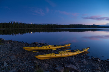 Fototapete - Two kayaks on the shore of a lake during a tranquil evening. Jamtland, Sweden.