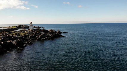 Sticker - Lighthouse at Hovsund fishing port, Gimsoya Lofoten Islands in Norway. Aerial view