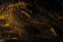 Splash Of Golden Sparkles On Black Background.