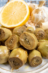 Wall Mural - Marinated artichokes with garlic, lemon and olive oil